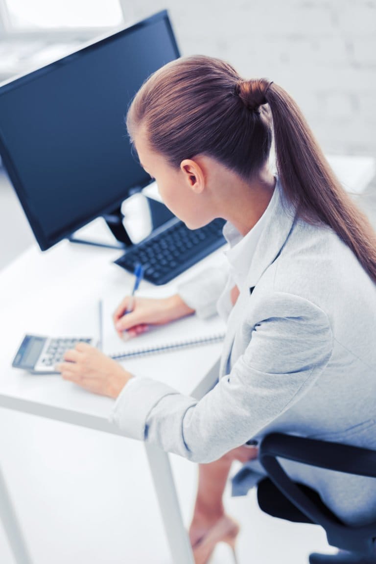 businesswoman with notebook and calculator PSJT9A4 768x1152 1