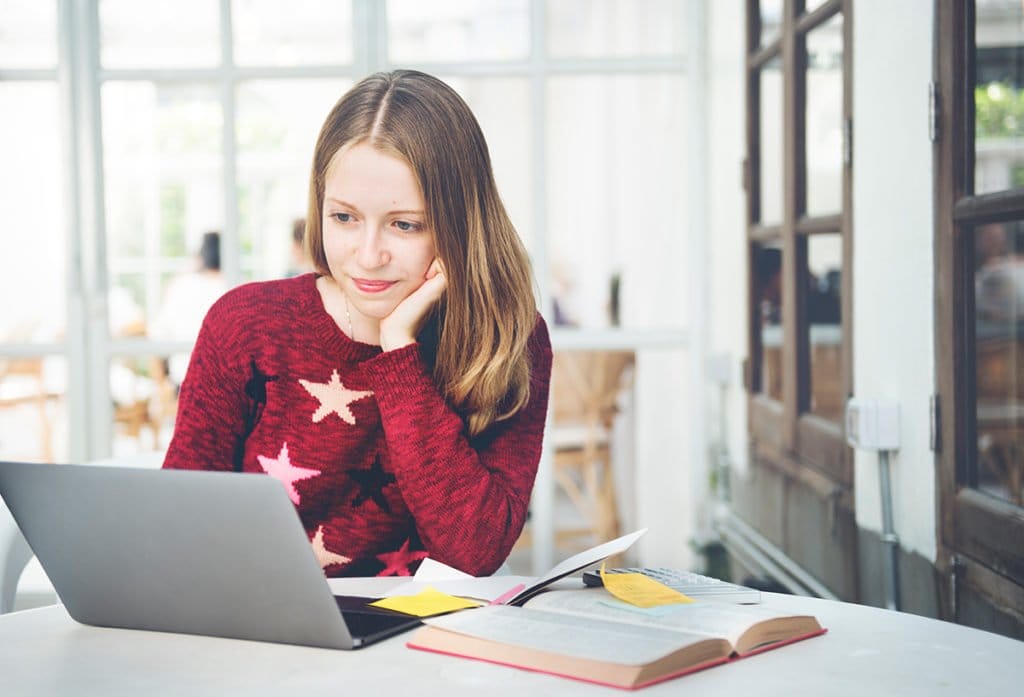 students woman studying online browsing e PHV28TX