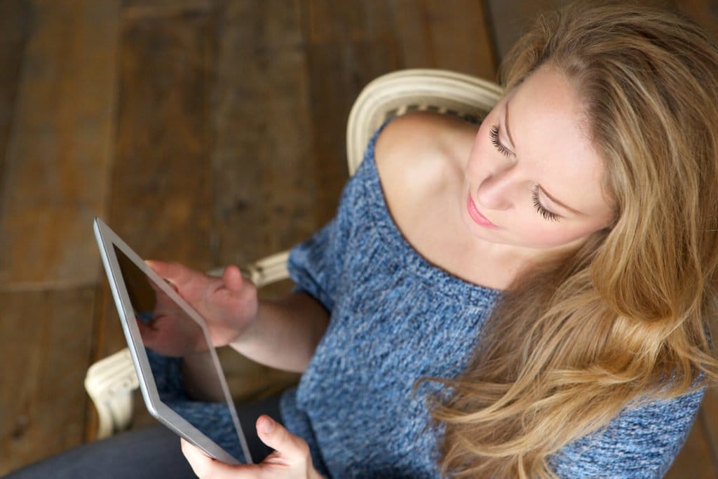 woman learning how to use touchscreen tablet P2WJCA7